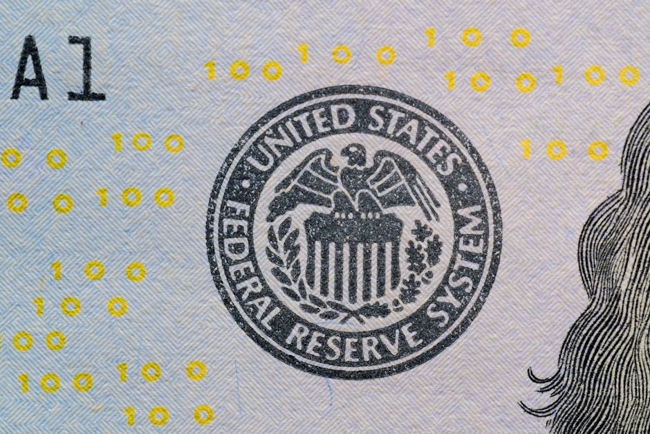 Detailed view of the US Federal Reserve System seal on currency with yellow digital numbers.